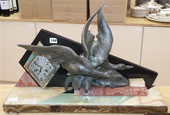 An Art Deco spelter and marble ducks mantel clock